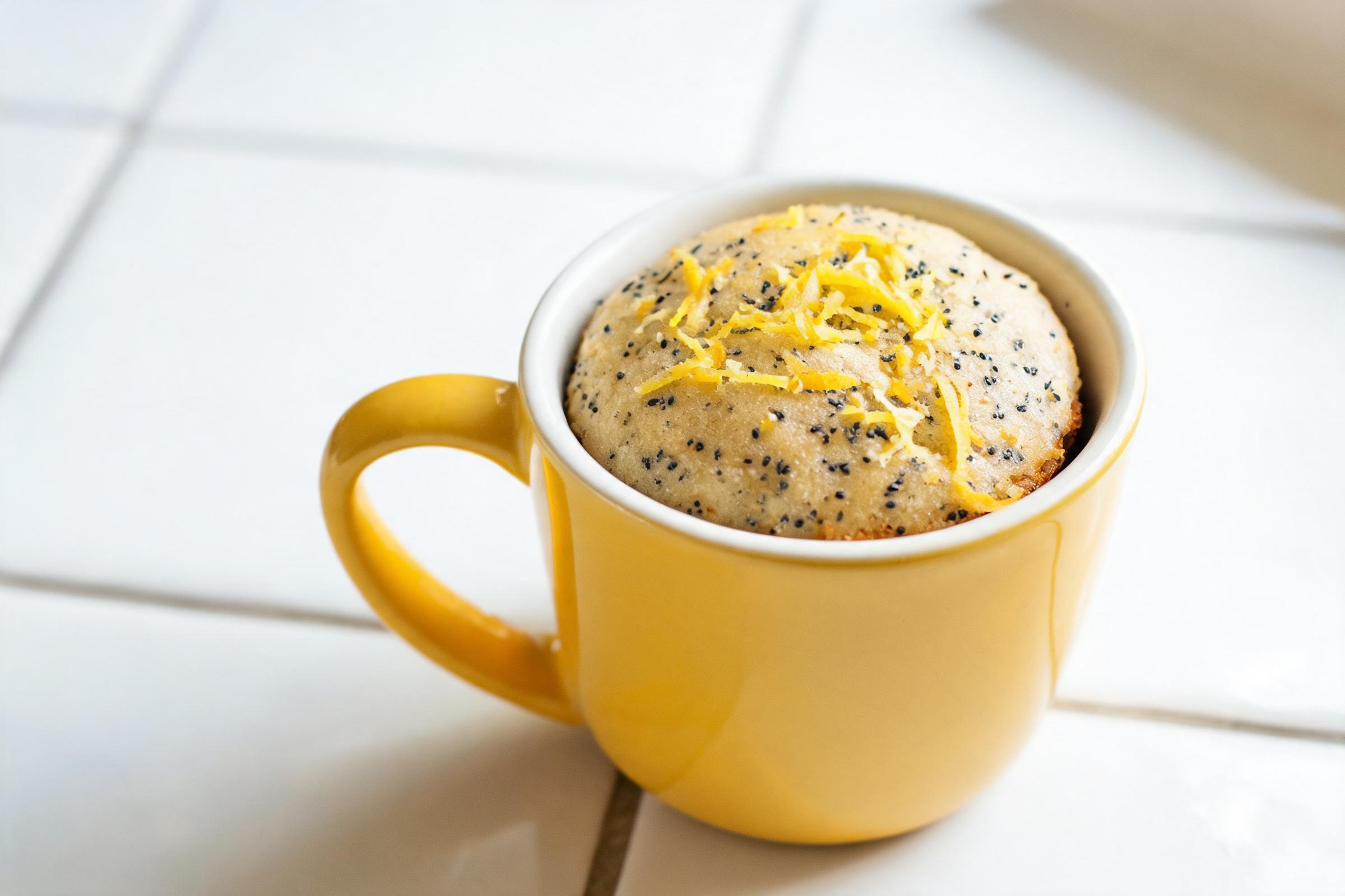 Dairy-free lemon poppy seed mug cake with a pale yellow crumb